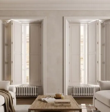 Solid panel full height shutters opening on a track in neutral living room