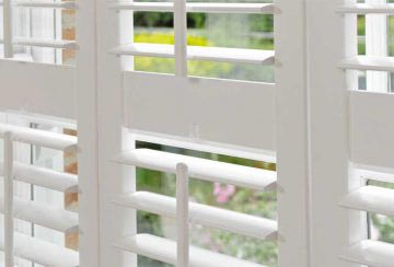 white-wooden-window-shutters white-wooden-window-shutters