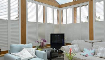 Living space with white shutters