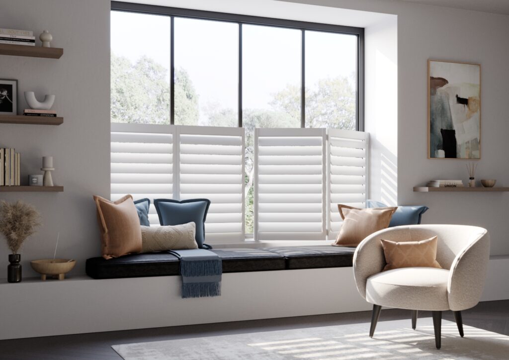 White cafe style window shutters behind seating area