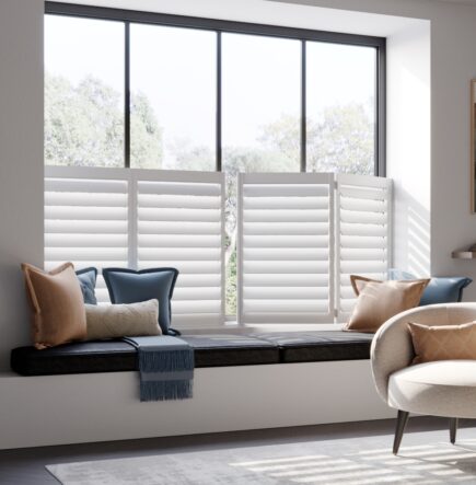 White cafe style window shutters behind seating area