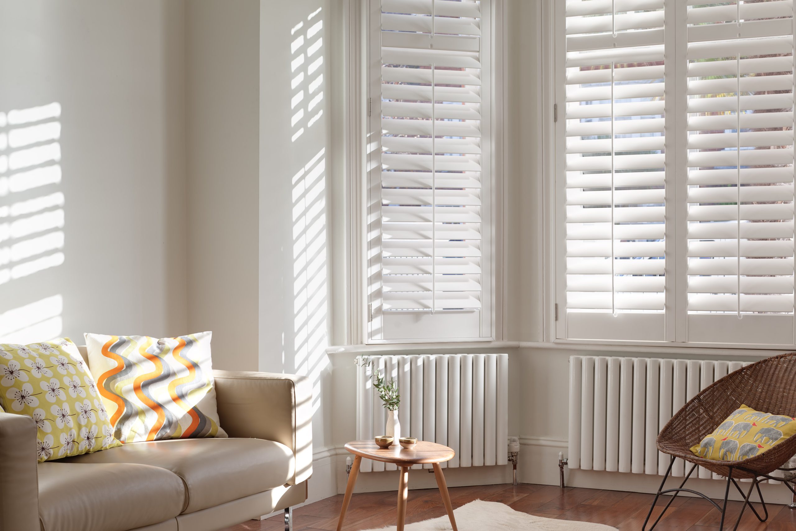 white full height shutters in a living room