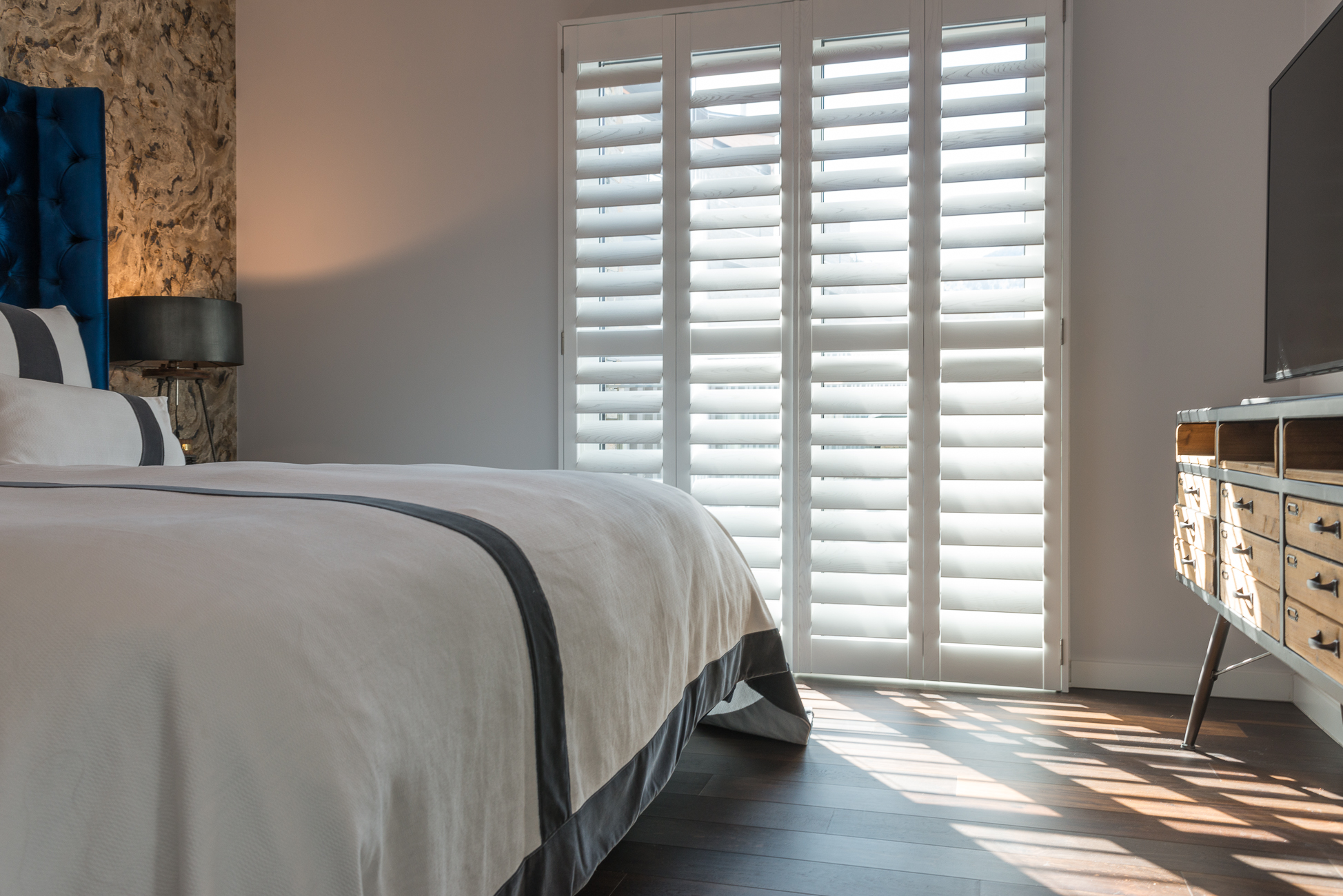 full height shutters in a bedroom