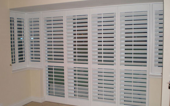 white bay window and door shutters