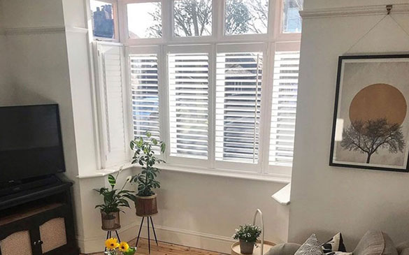 white bay window shutters