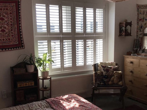 white tier on tier bedroom shutters