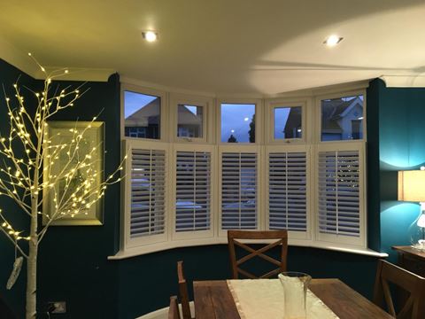 white cafe style bay shutters