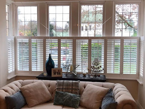white cafe style bay shutters