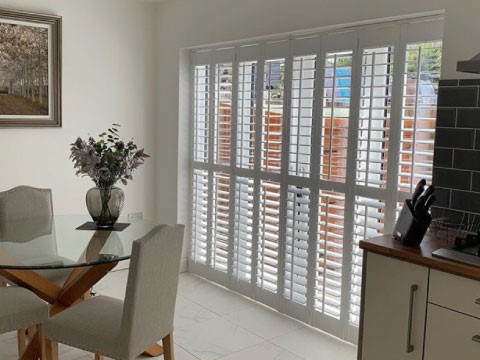 white kitchen patio shutters