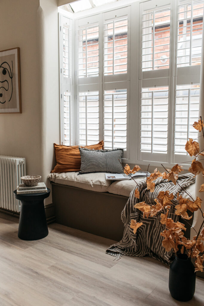 Living space with white shutters