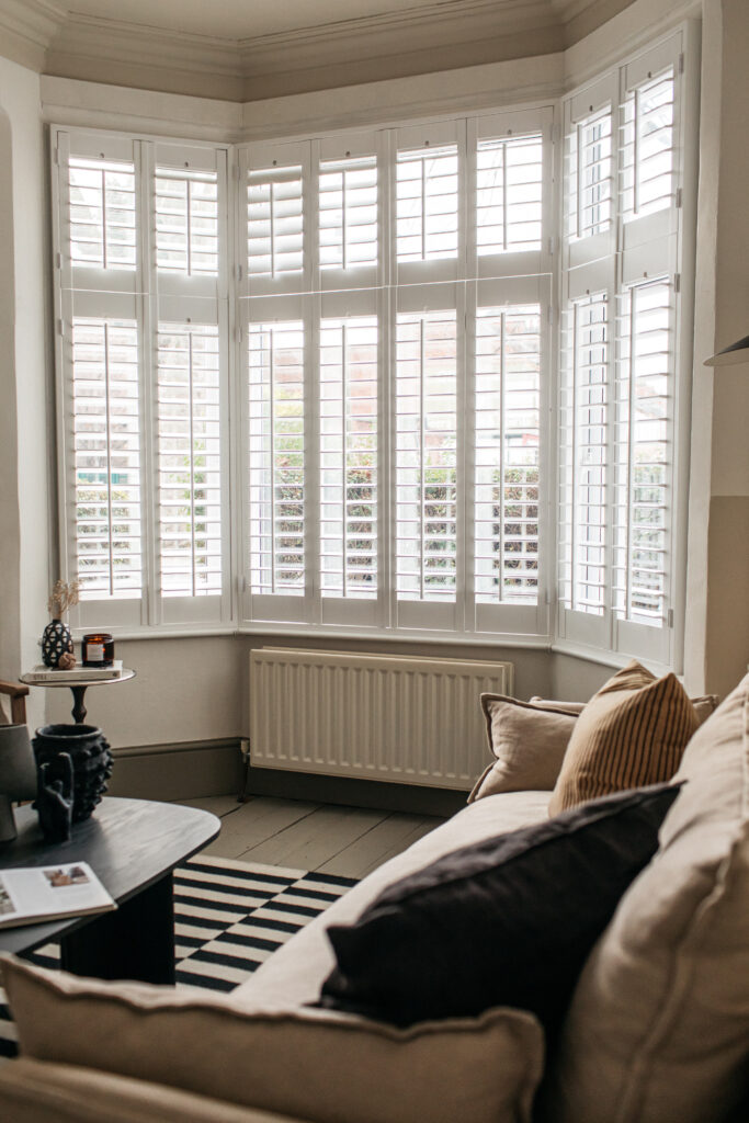 Living room with white shutters