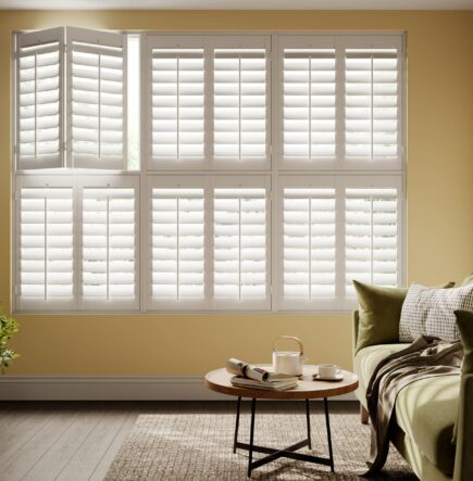 white shutters on yellow wall in living room